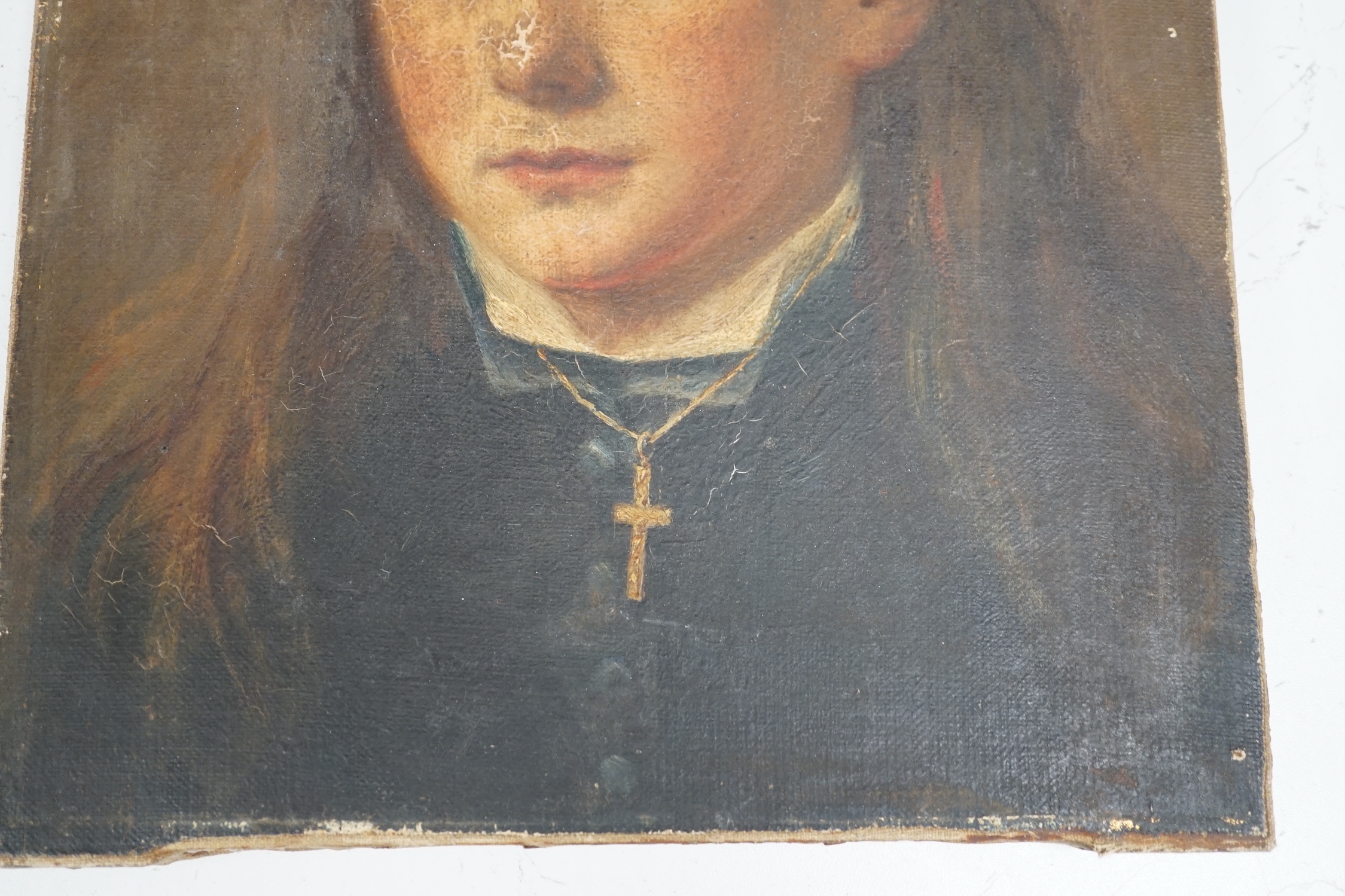 19th century English school, oil on canvas, Portrait of a youth wearing a crucifix, 34 x 27cm, unframed